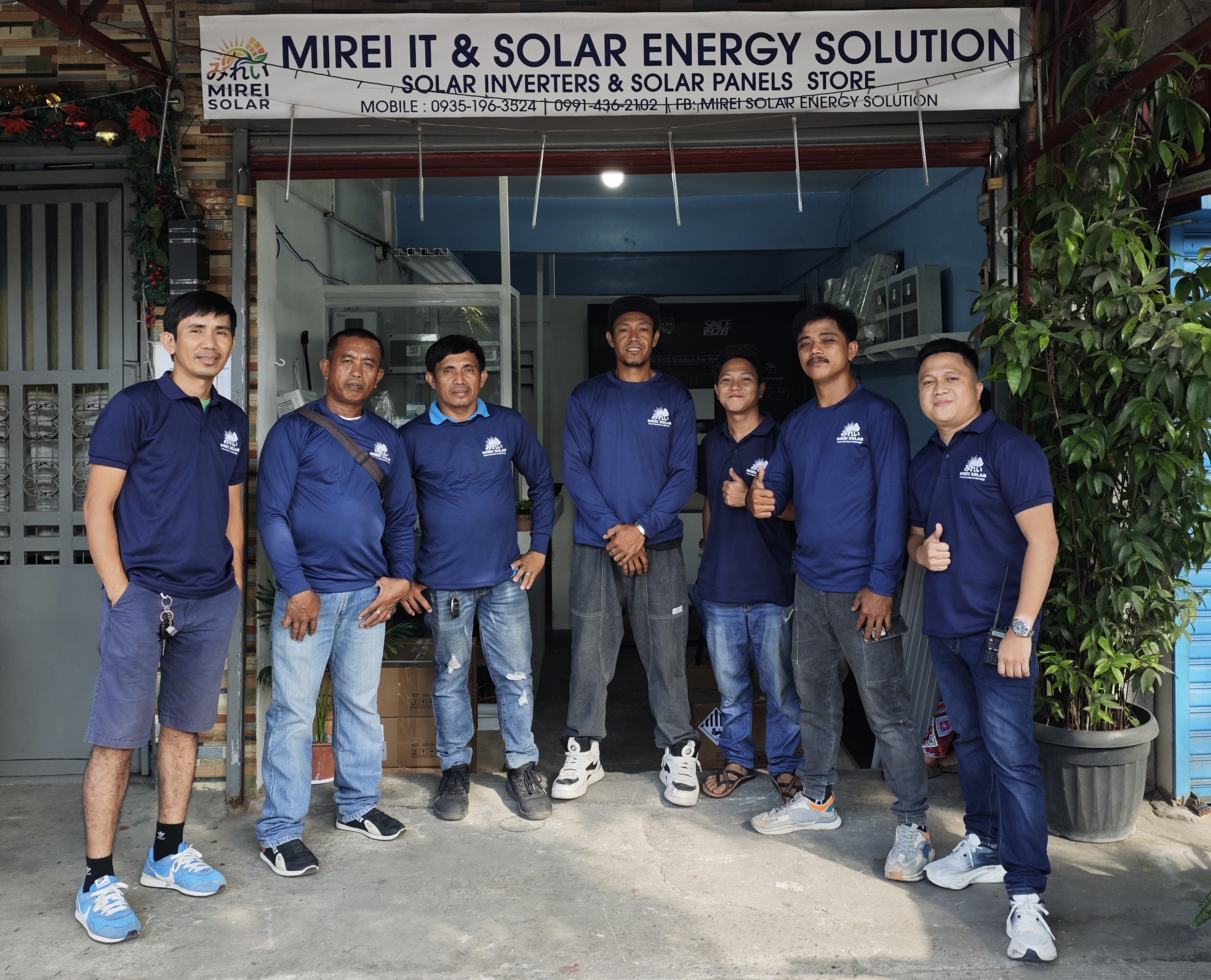 Technician installing solar panels on a residential roof